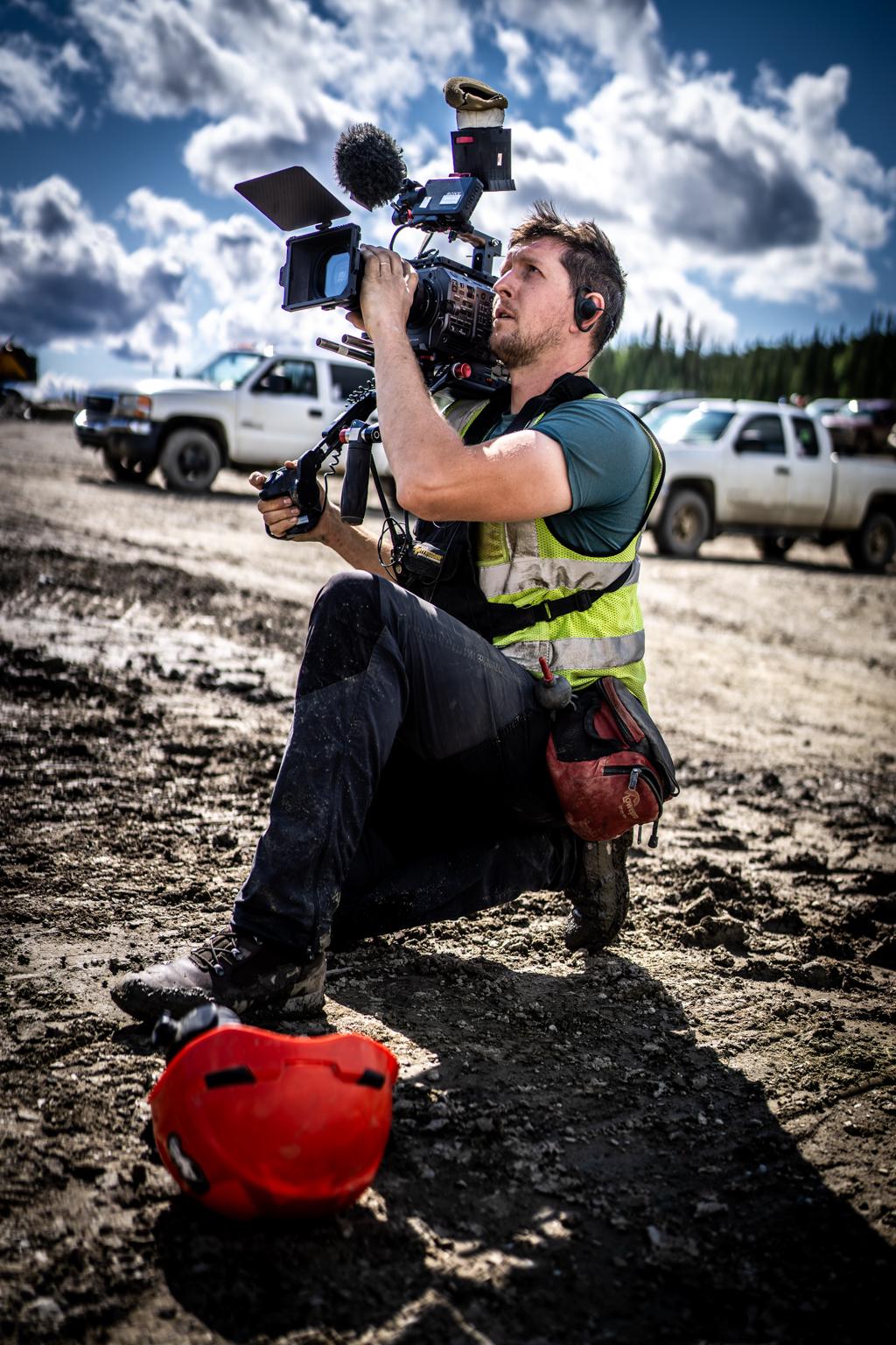 George Richardson operating a broadcast camera on location
